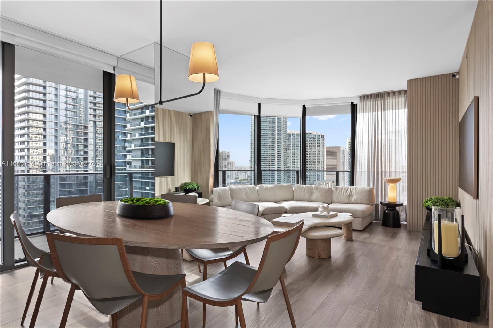 a dining room with furniture and wooden floor