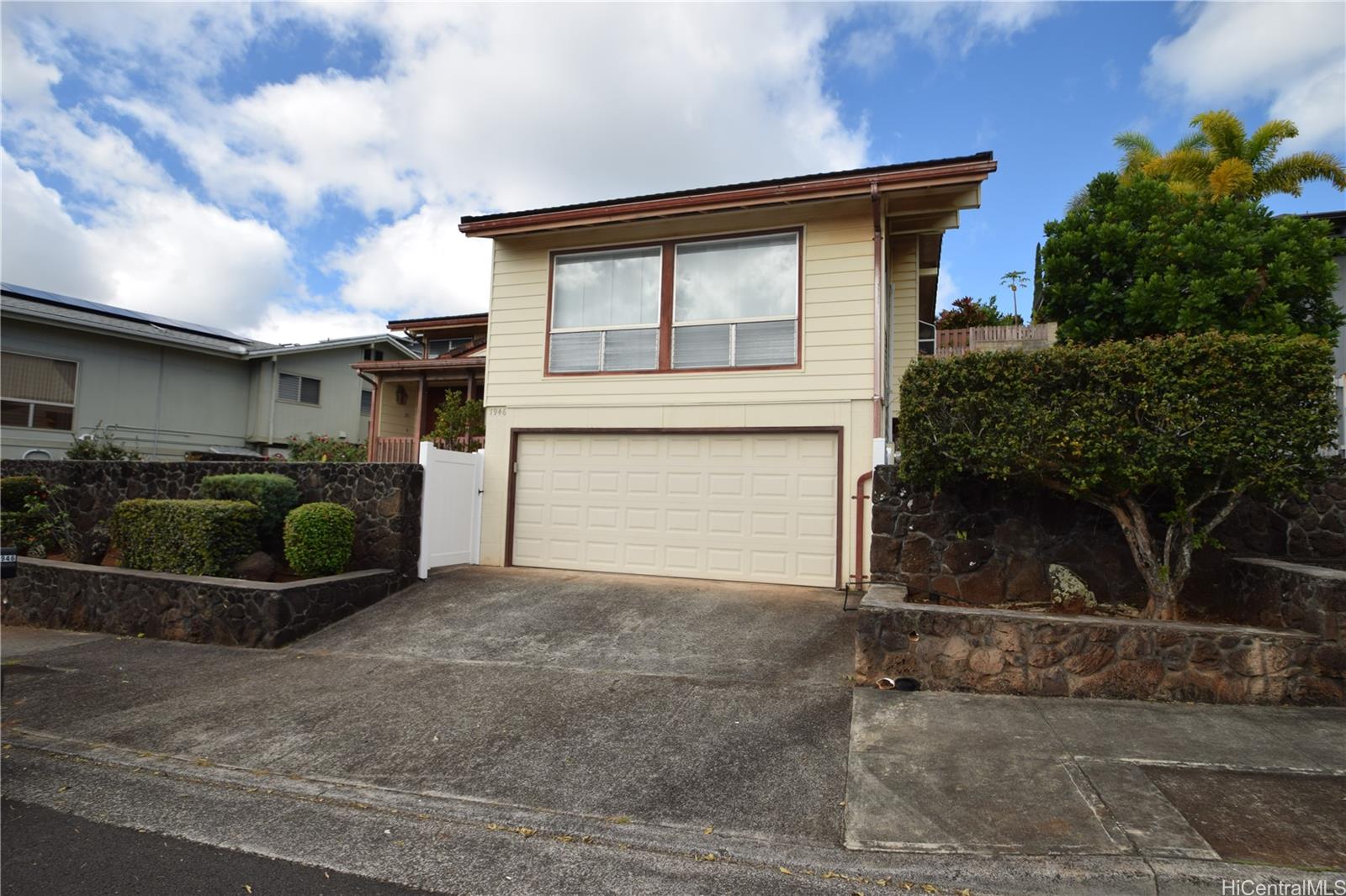 a front view of a house with garage