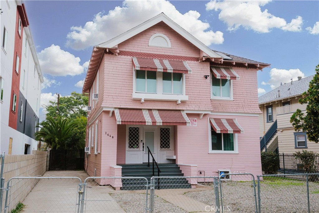 a front view of a house with garage