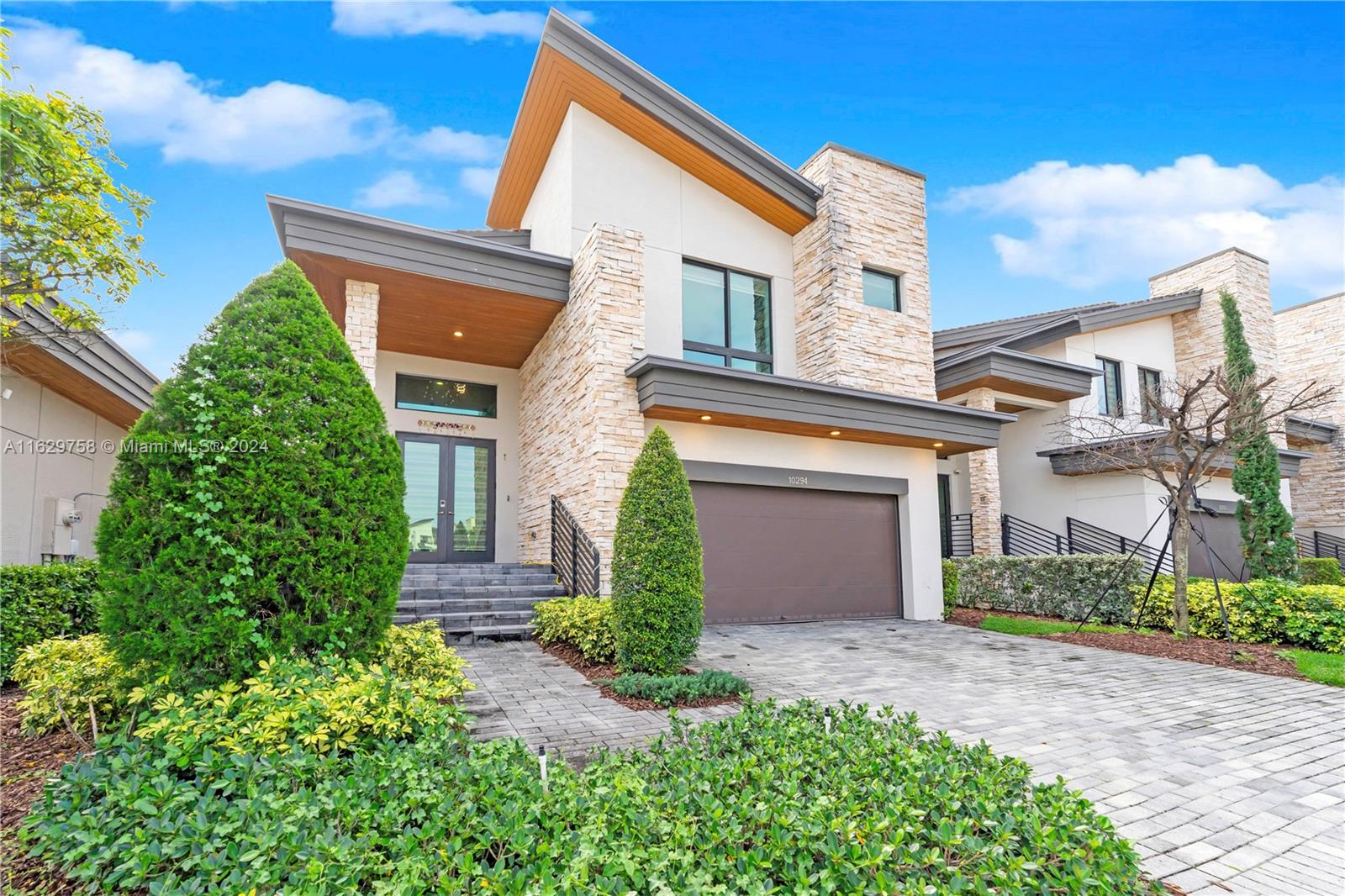 front view of a house with a yard