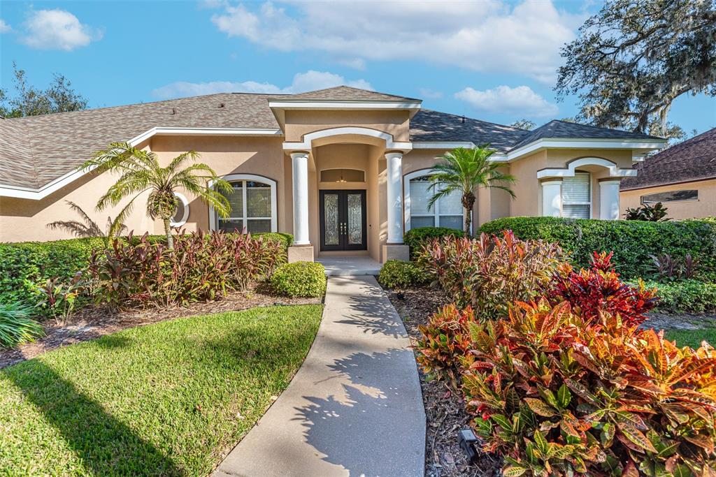 Colorful florida friendly landscaping and curb appeal.