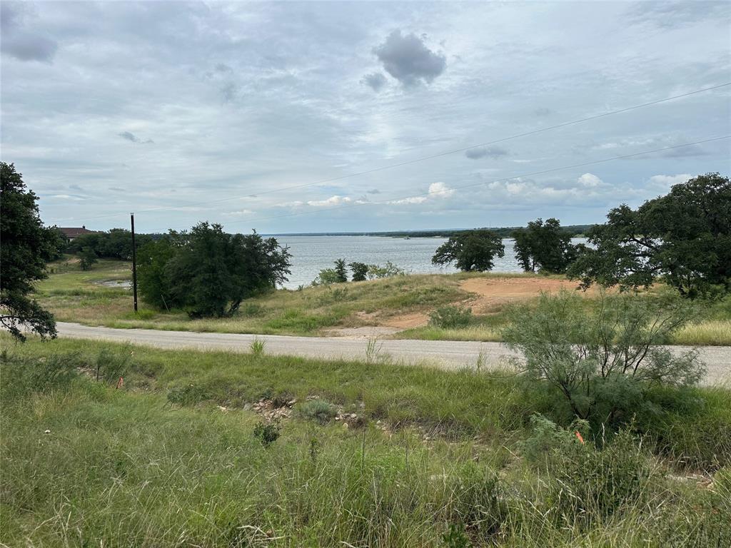 a view of a lake view with houses in back