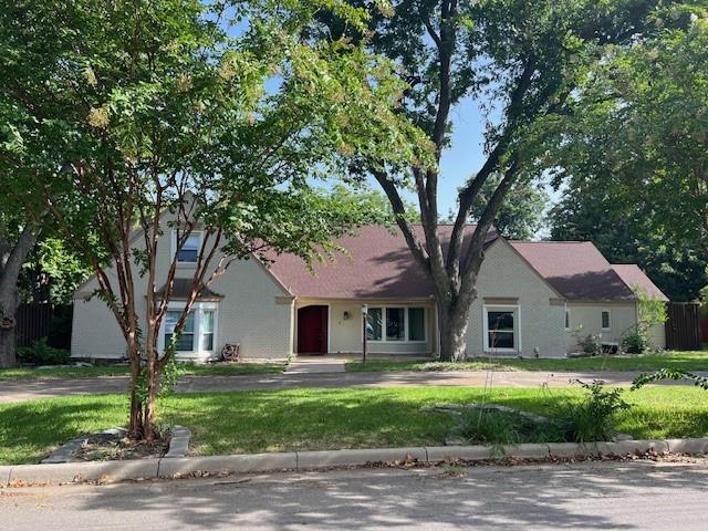 a house that has tree in front of it