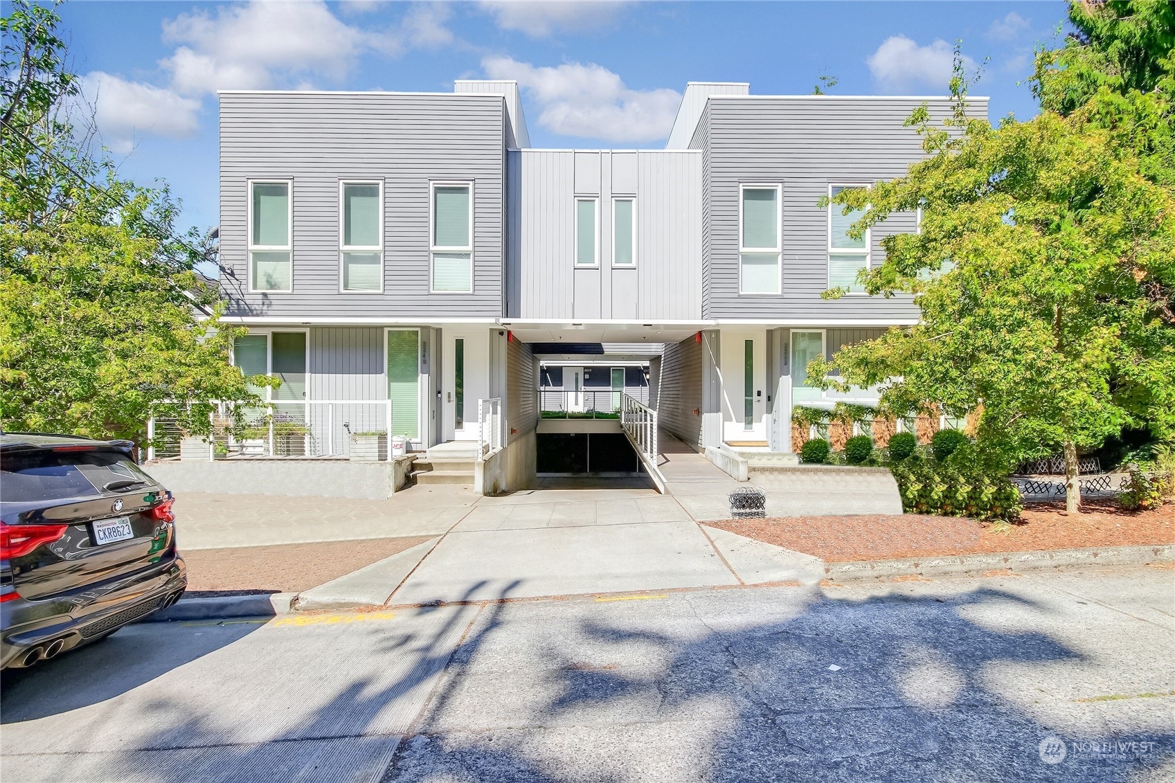 a front view of a building with parking area