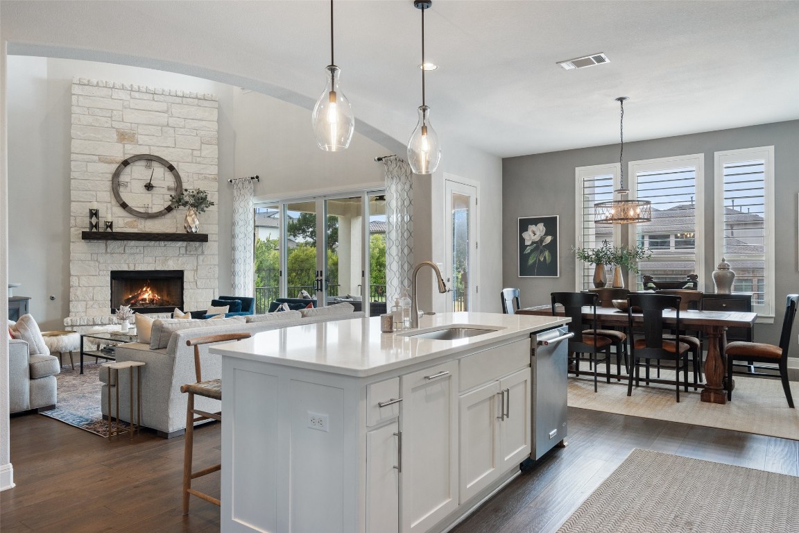 a large kitchen with a table chairs and a stove