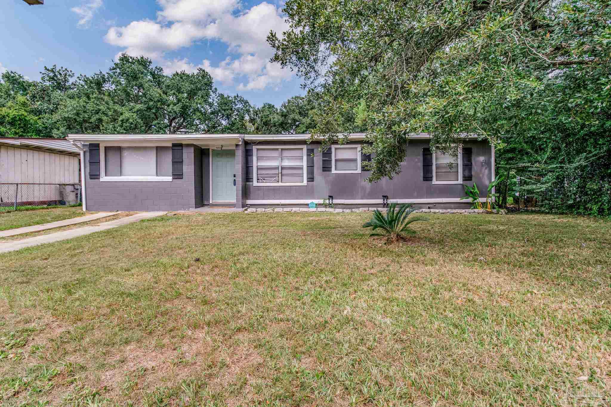 front view of a house with a yard