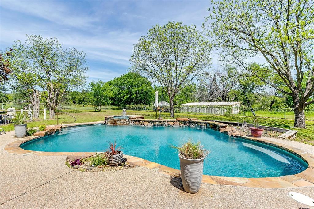 a view of a swimming pool with a lounge chairs