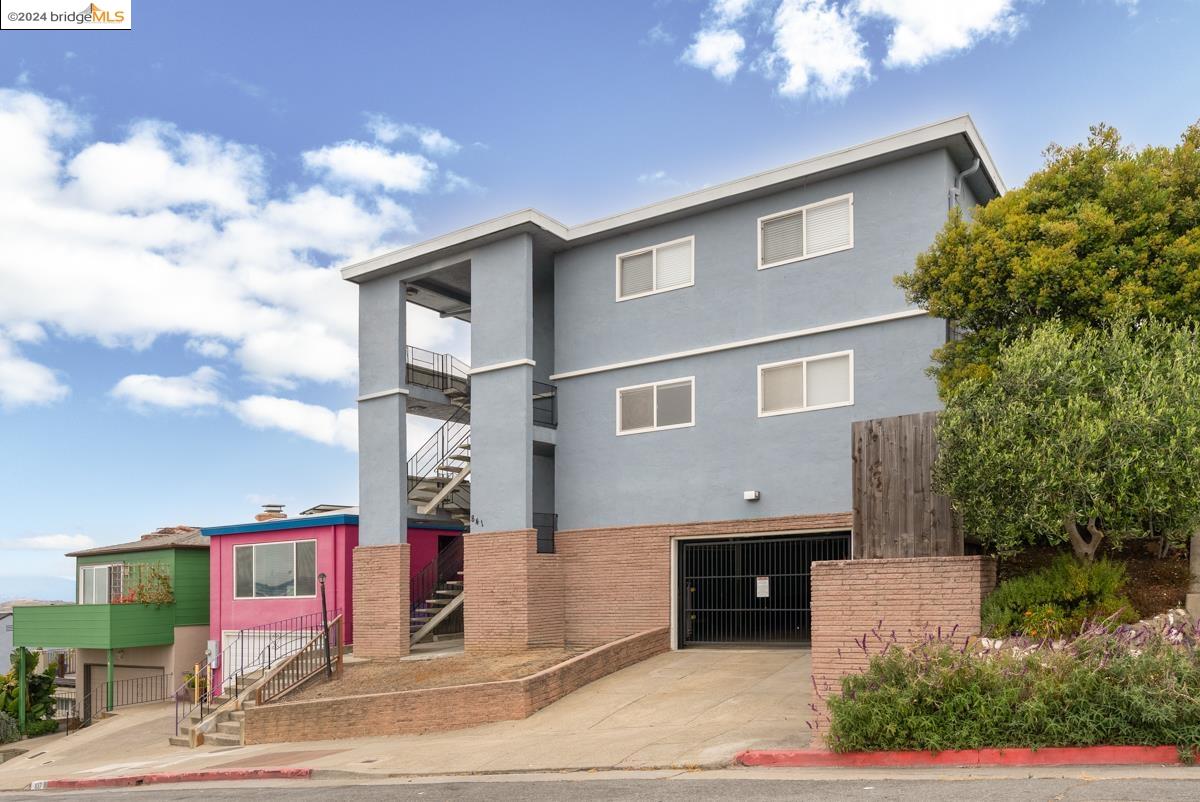 a front view of a house with parking