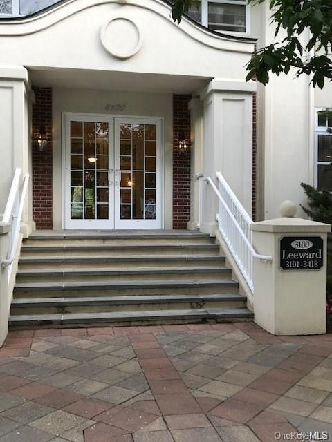 View of exterior entry featuring french doors