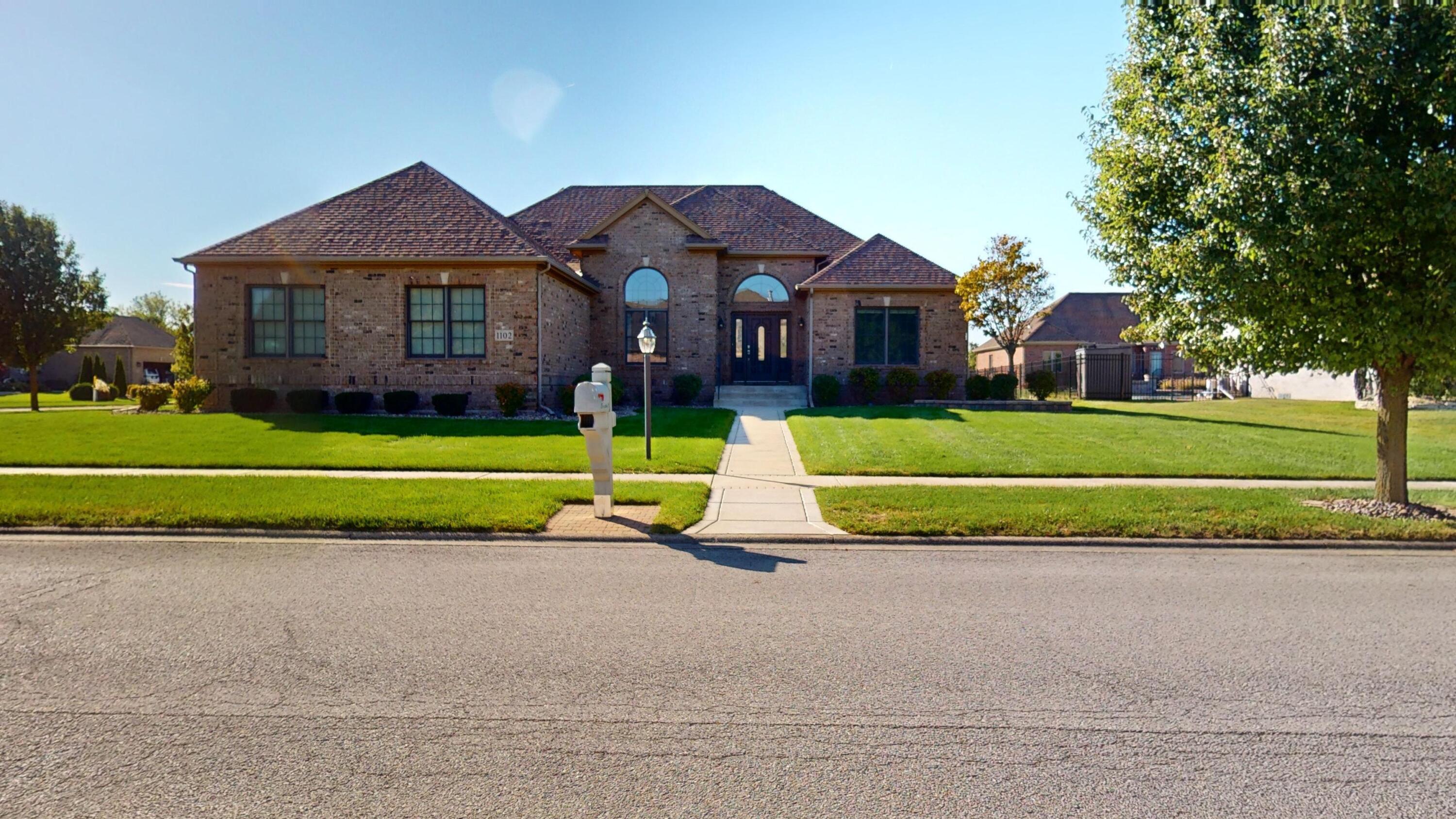 a view of a parked cars in front of a house