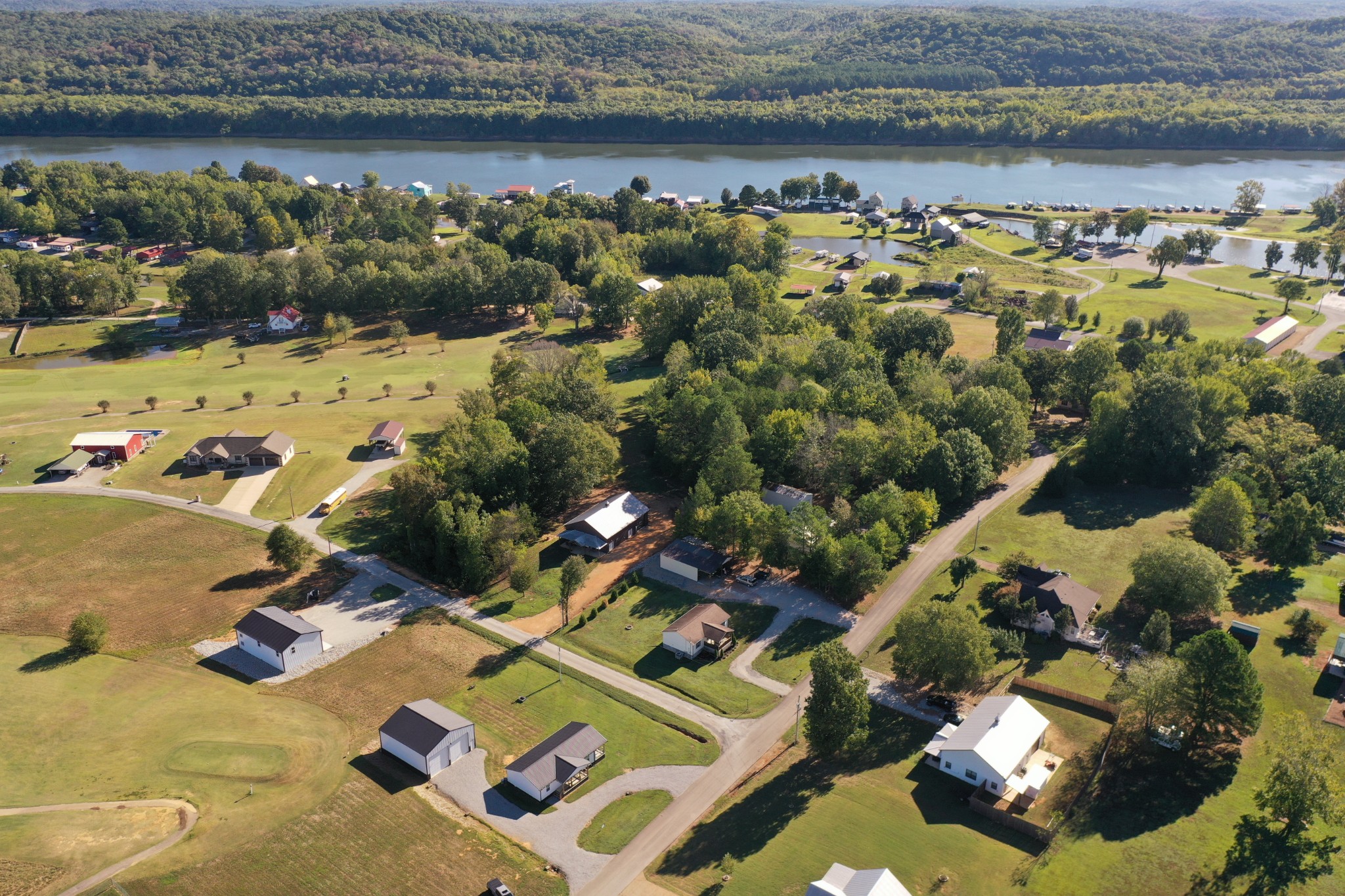 an aerial view of a house with a lake view