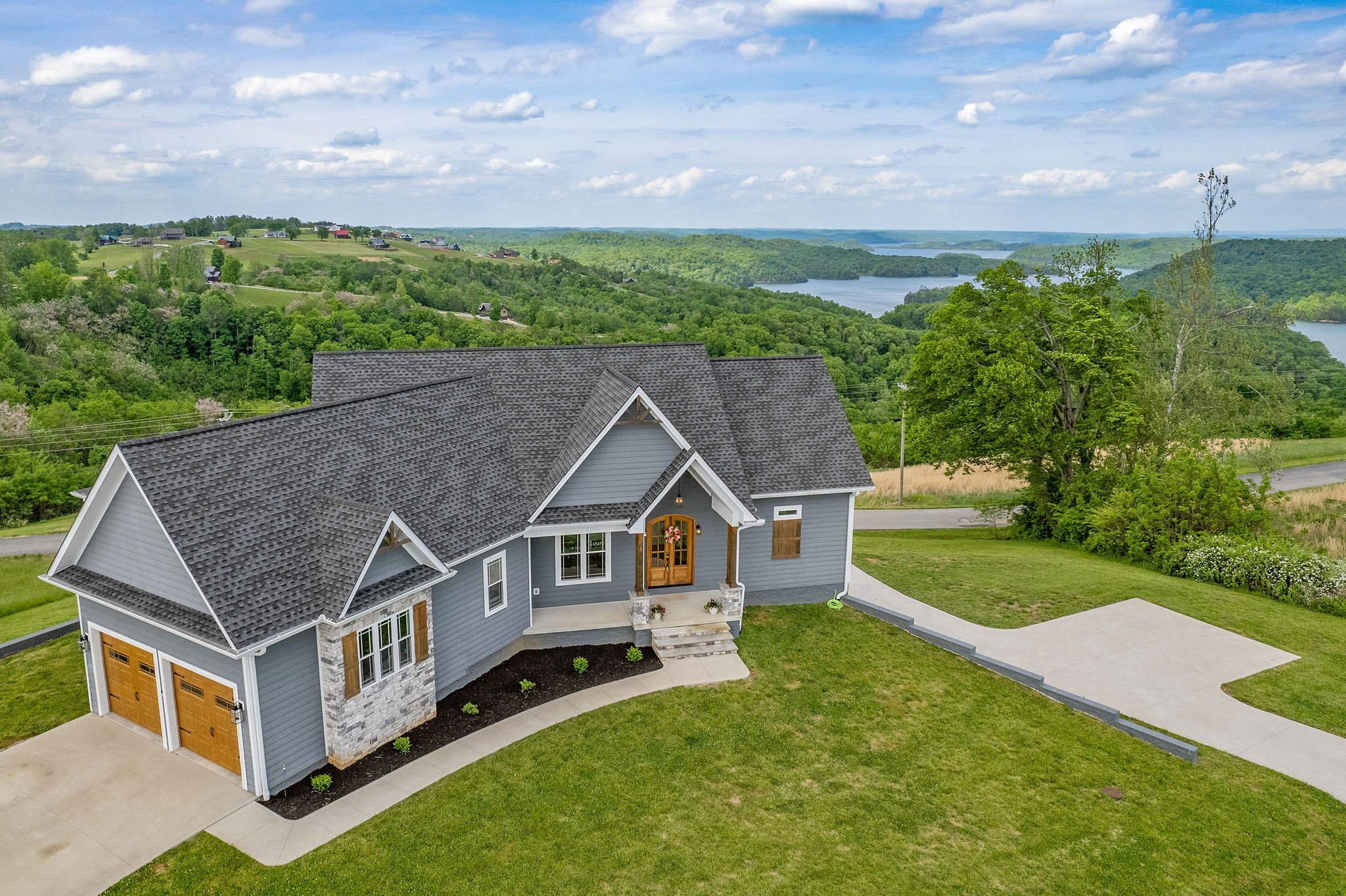 an aerial view of a house with a big yard