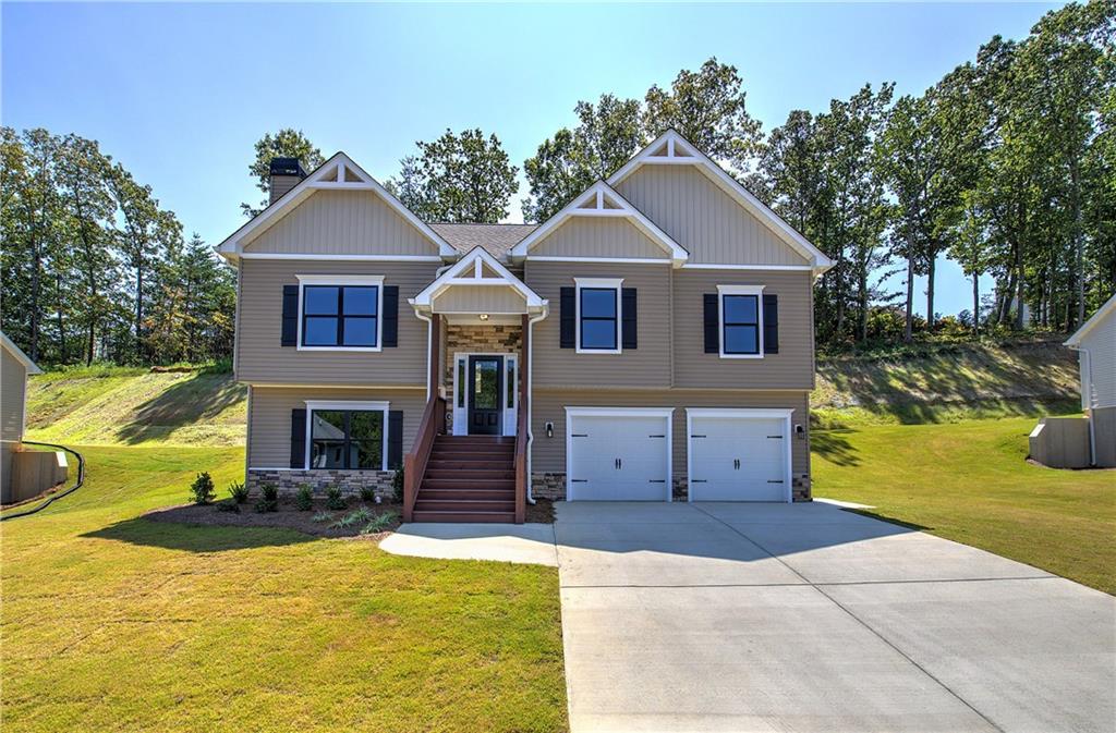 a front view of a house with a yard