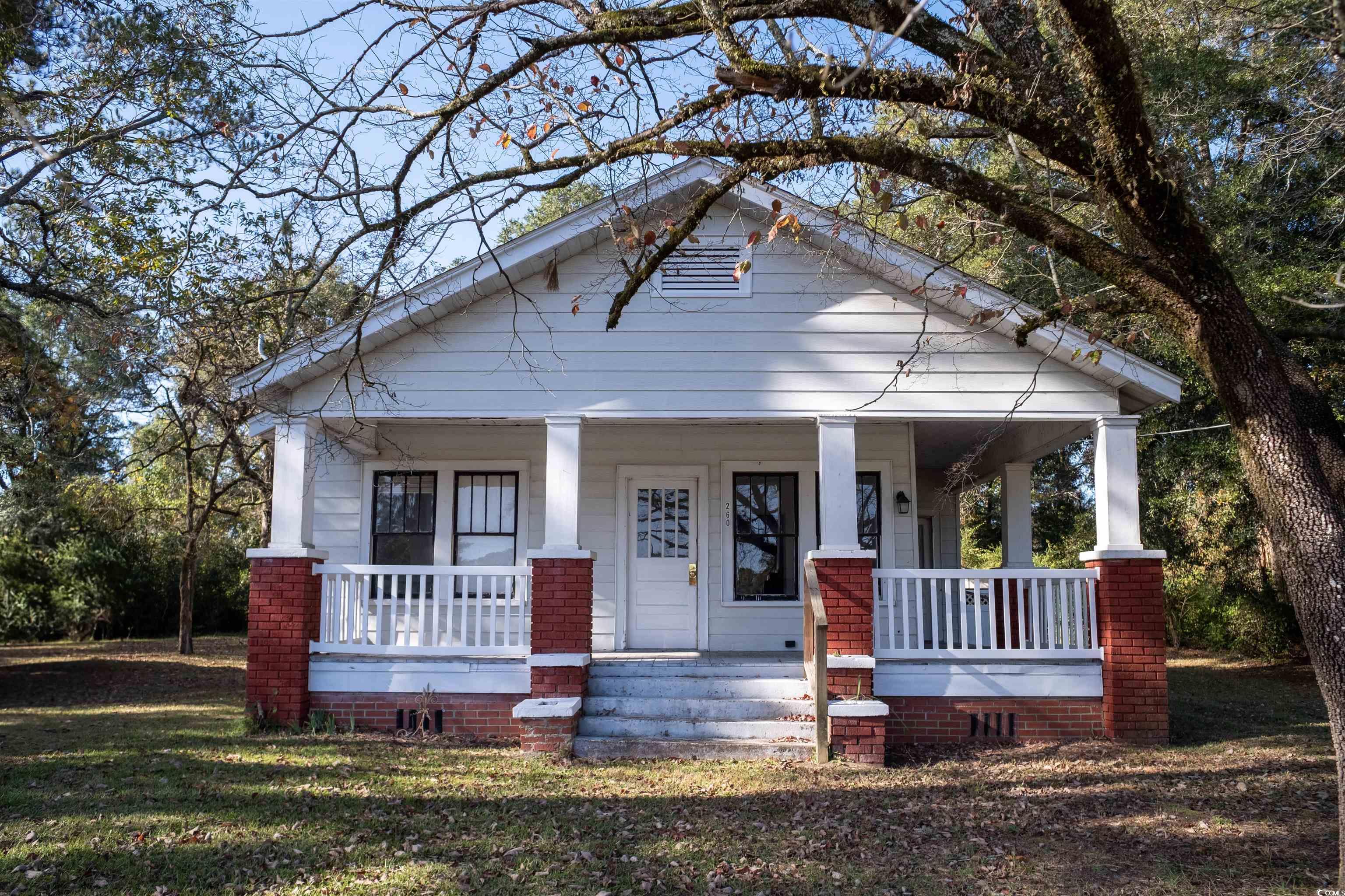 View of front of property featuring covered porch