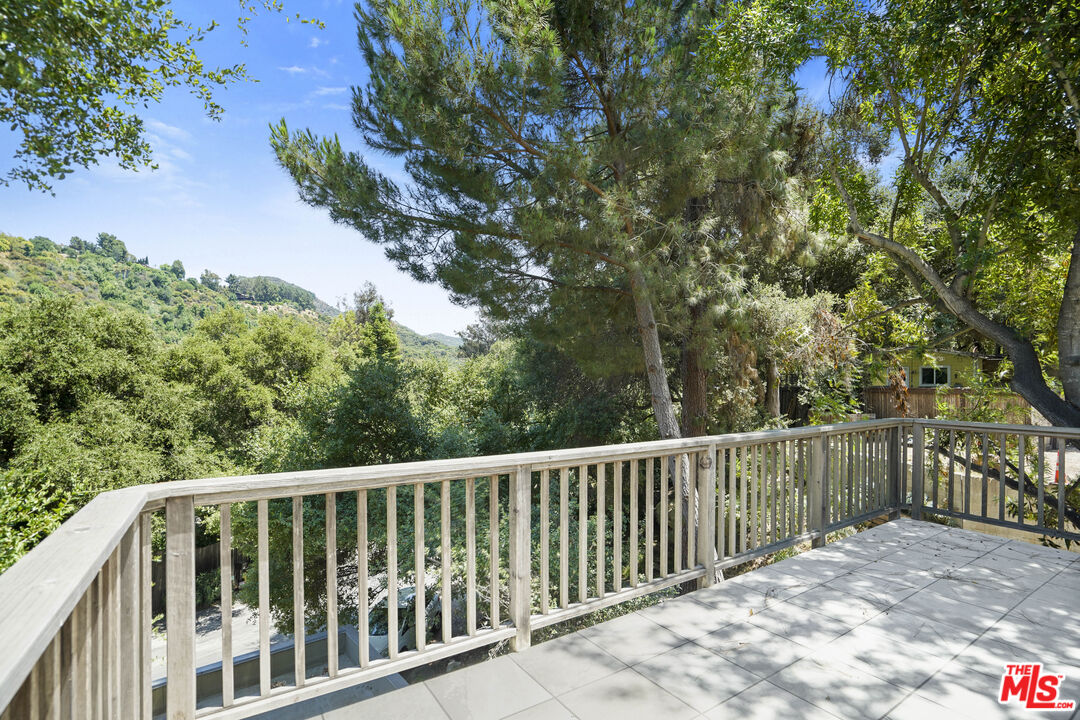 a balcony with wooden fence