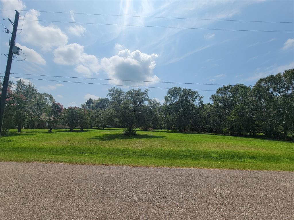 a view of a golf course with a big yard