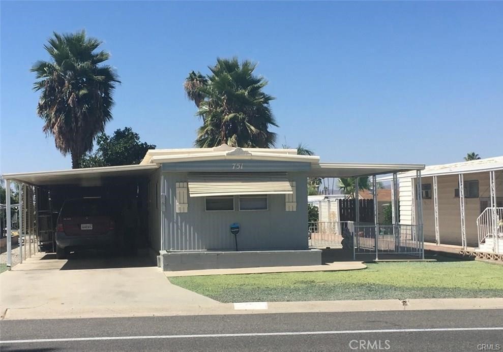 a view of a house with a yard and garage