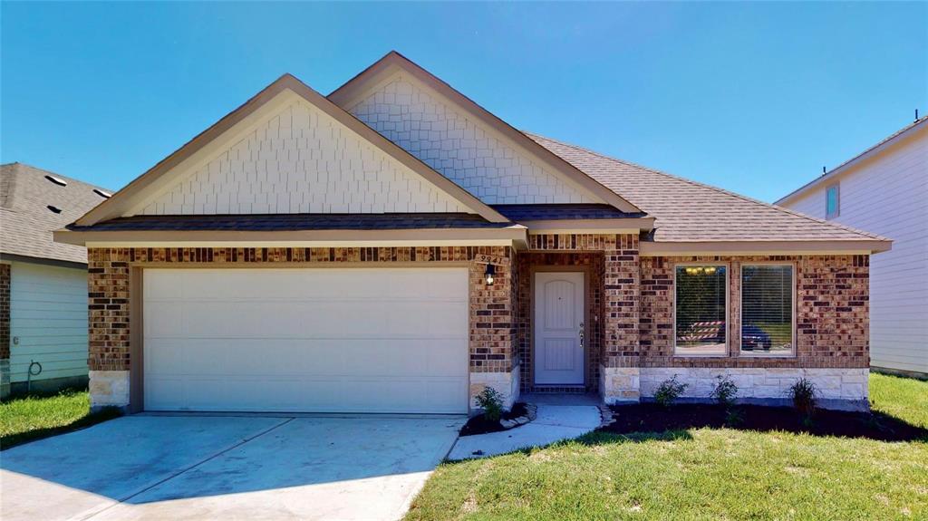 The charming exterior of this traditional Saratoga Home showcases its inviting brick façade and neatly landscaped front yard. The Elise Floor Plan is thoughtfully designed with a spacious 2-car attached garage, offering ample parking and storage. This is a picture of an Elise Floor Plan with another Saratoga Homes.