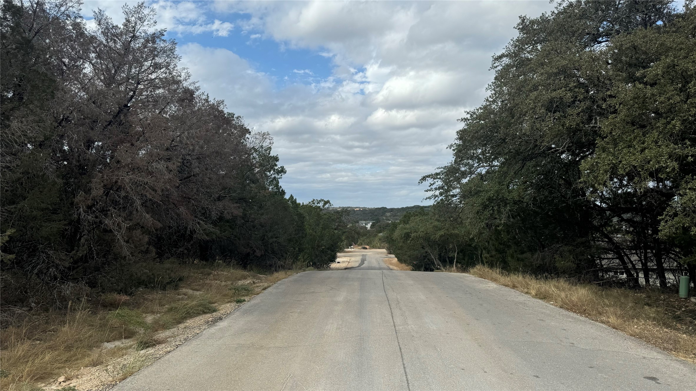 a view of a road with a yard