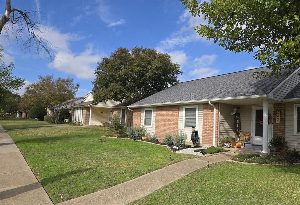 front view of a house with a yard