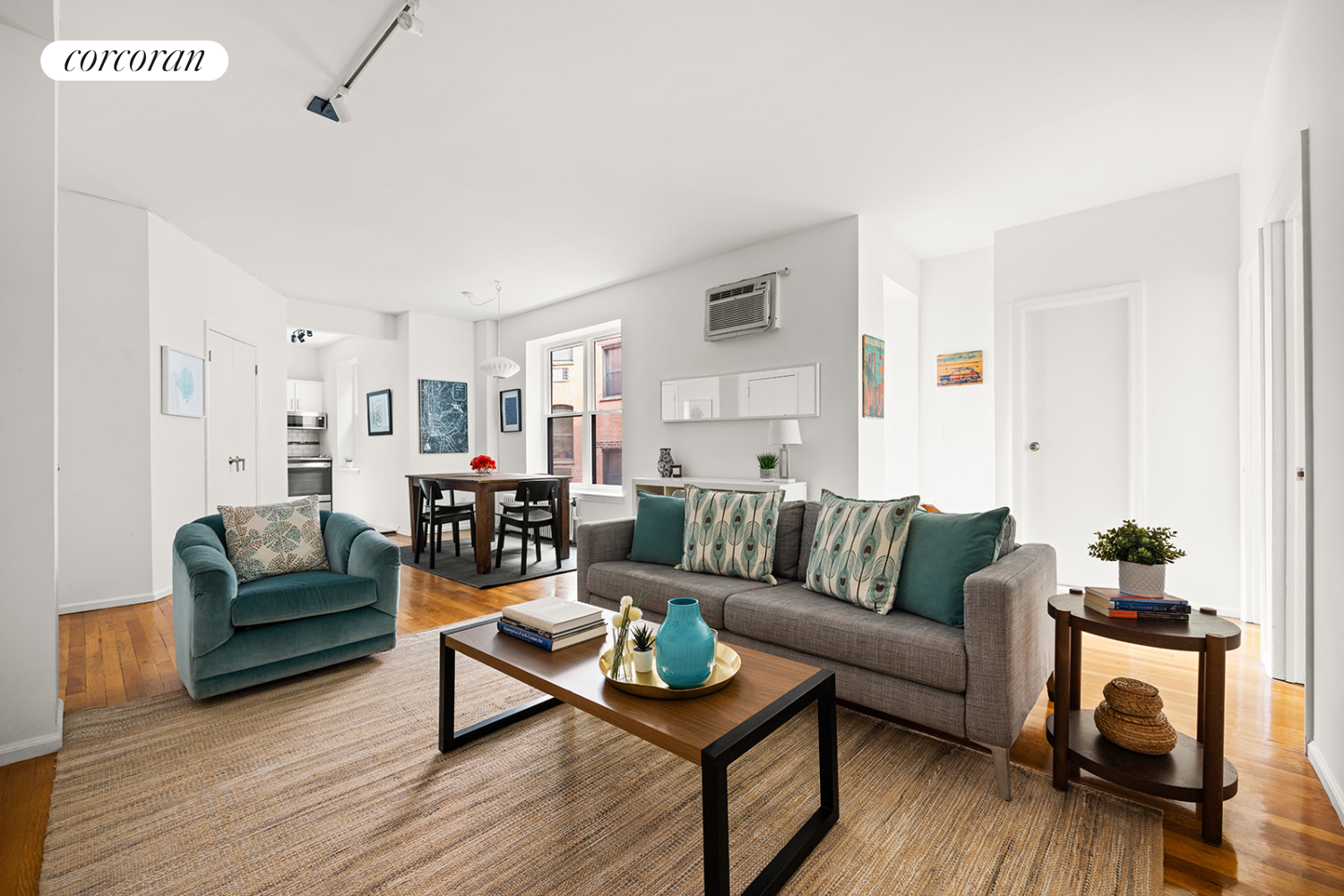 a living room with furniture and a wooden floor