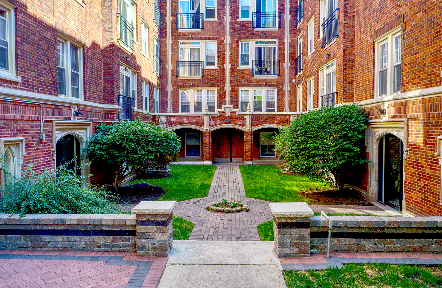 a front view of a building with garden and entertaining space