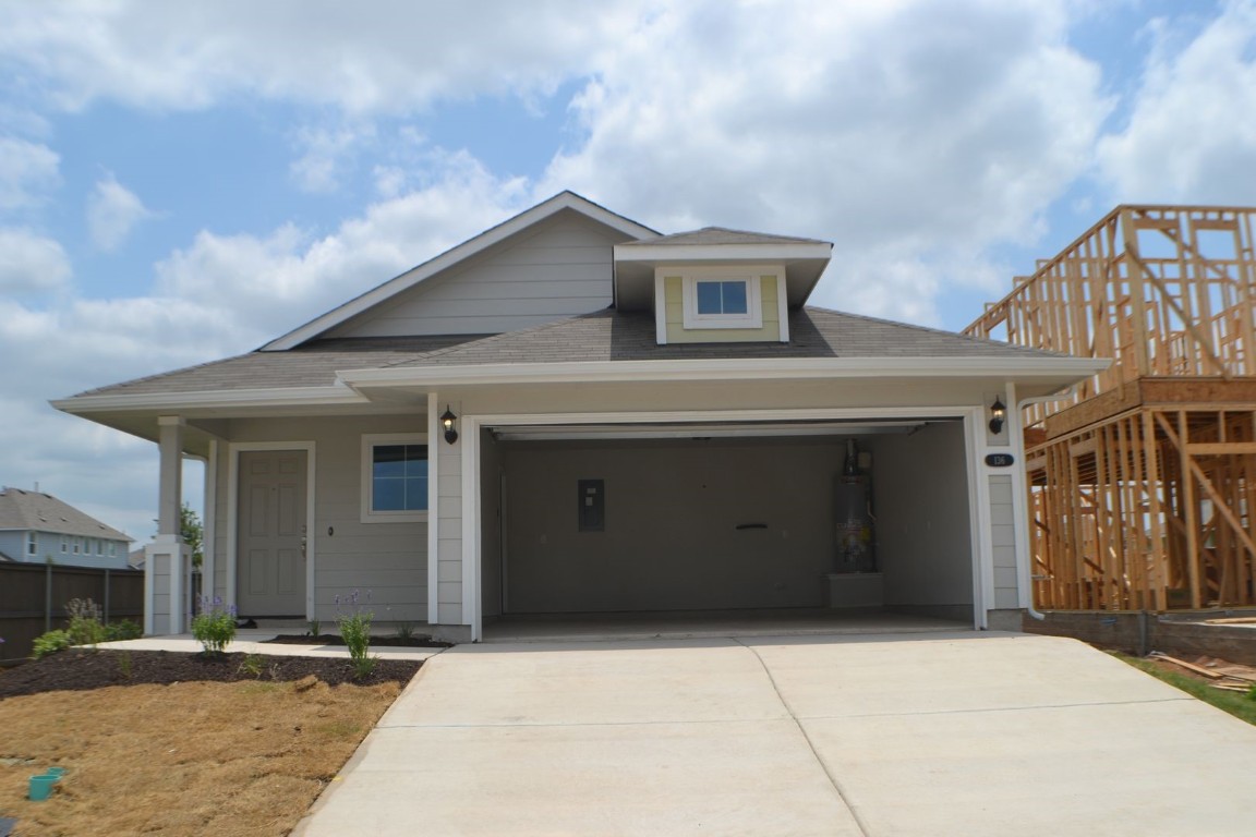 a front view of a house with garage