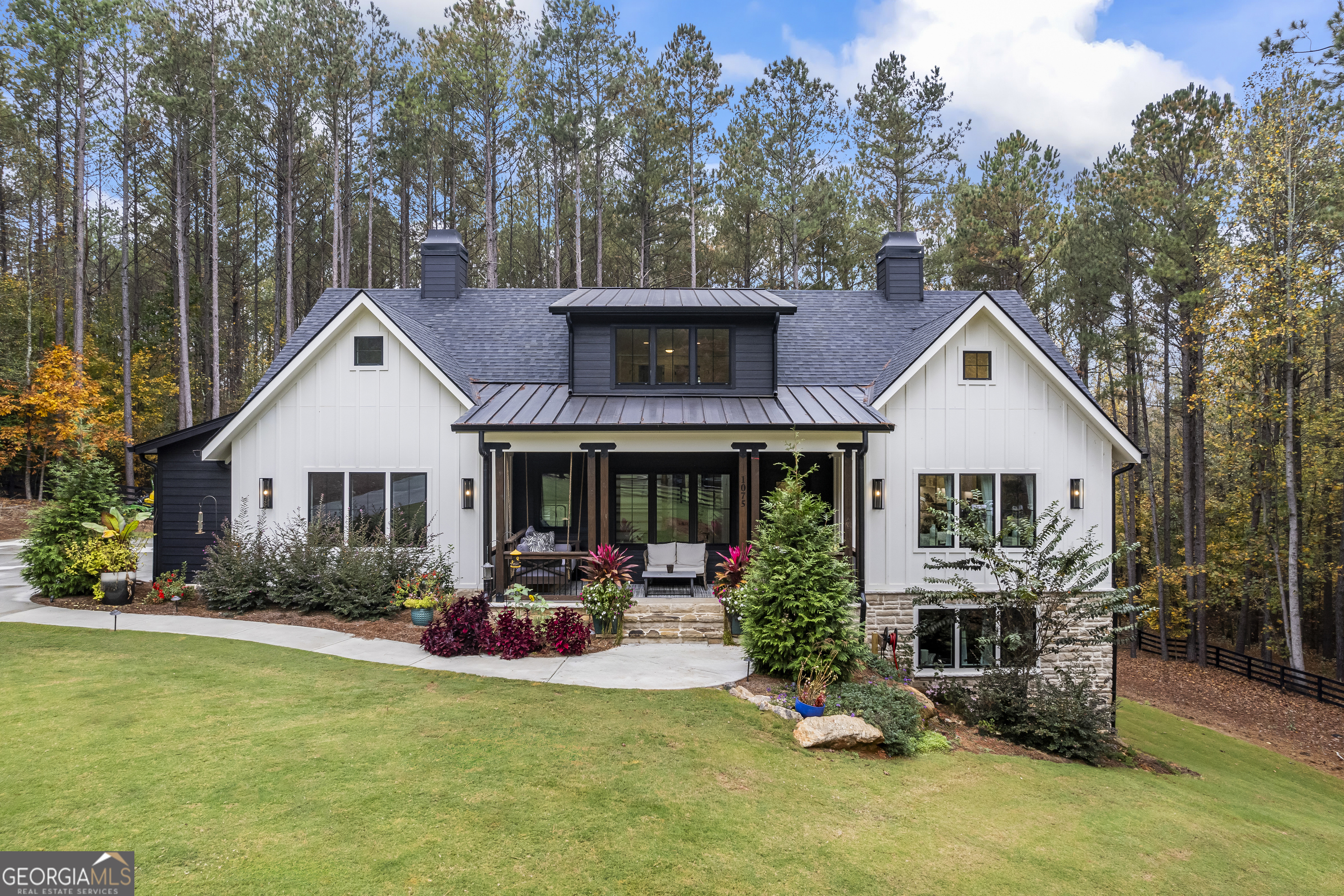 a front view of house with yard and green space