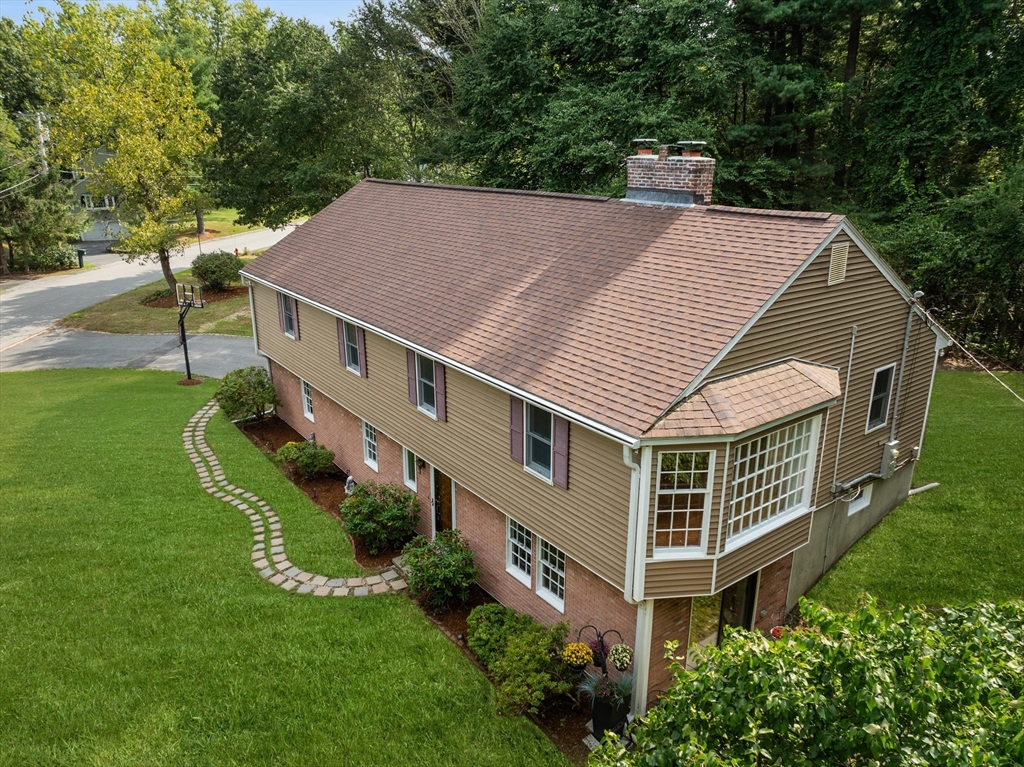 a aerial view of a house with a yard