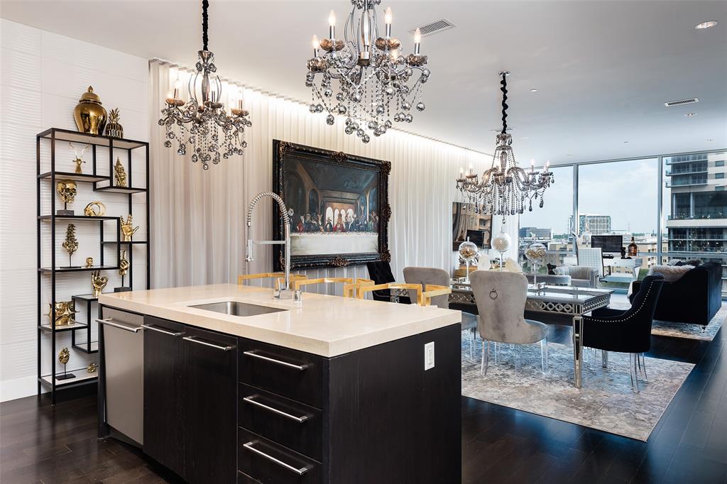 a view of a dining room with furniture wooden floor and chandelier