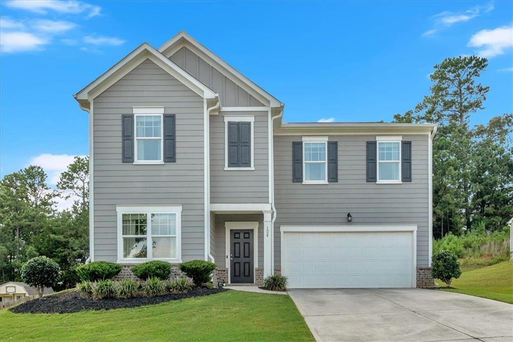 a front view of a house with a yard