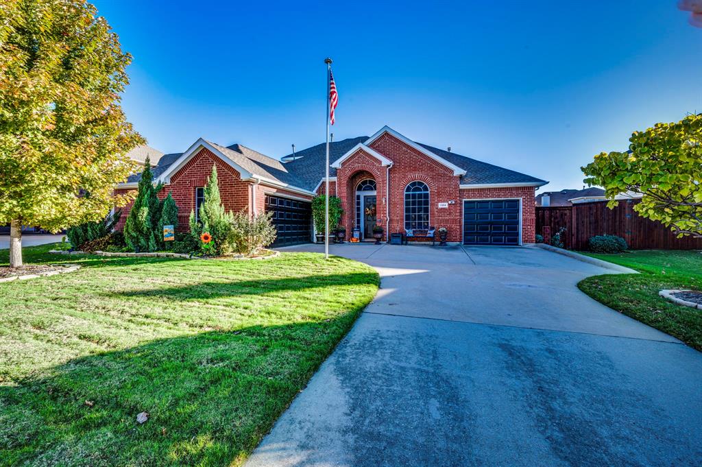 a front view of a house with yard