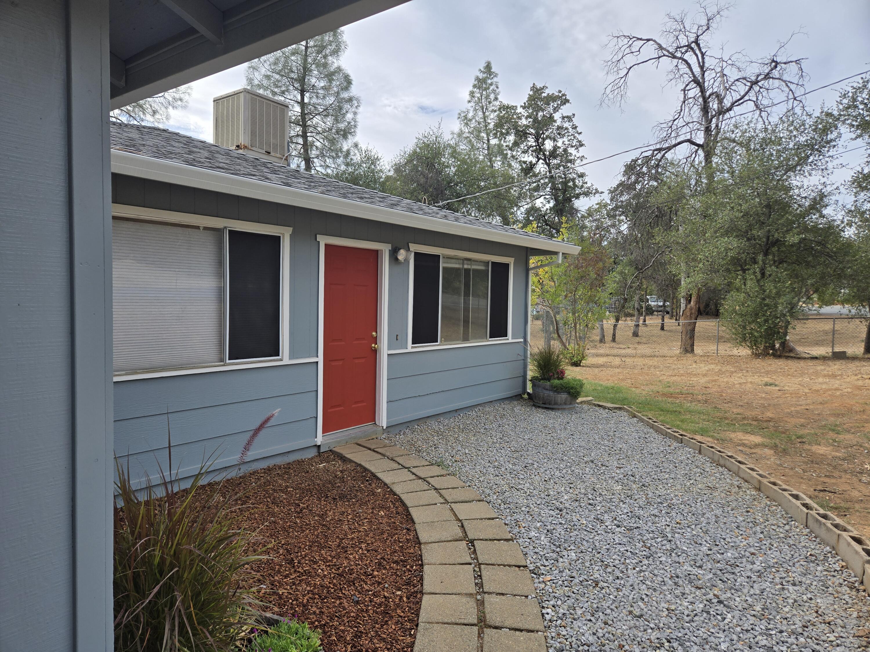 a view of a house with a tree