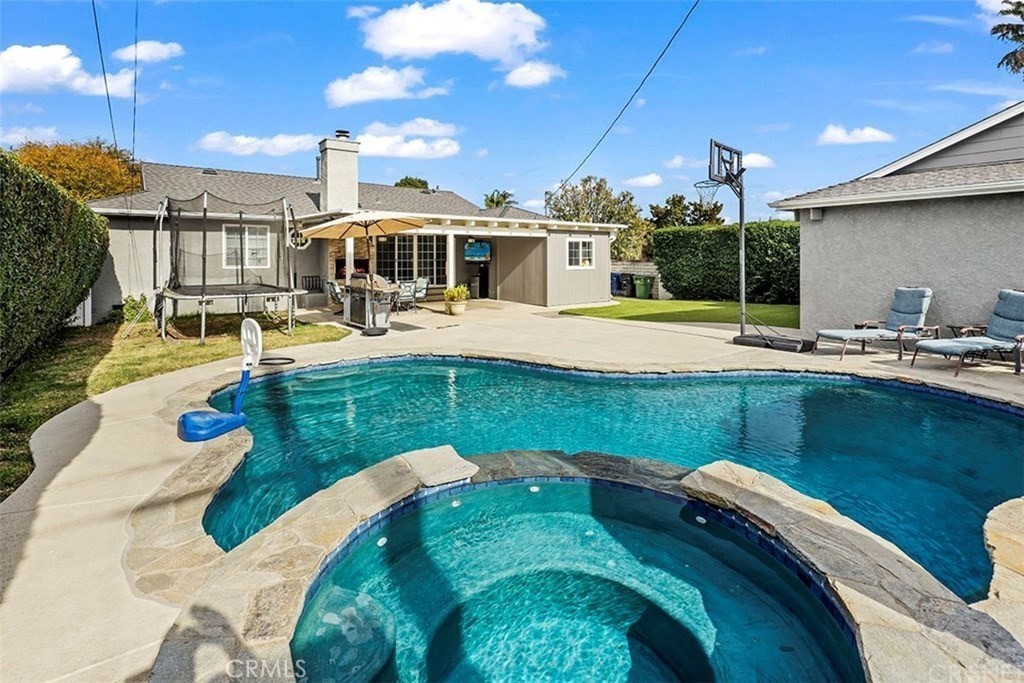 a view of a swimming pool with a patio