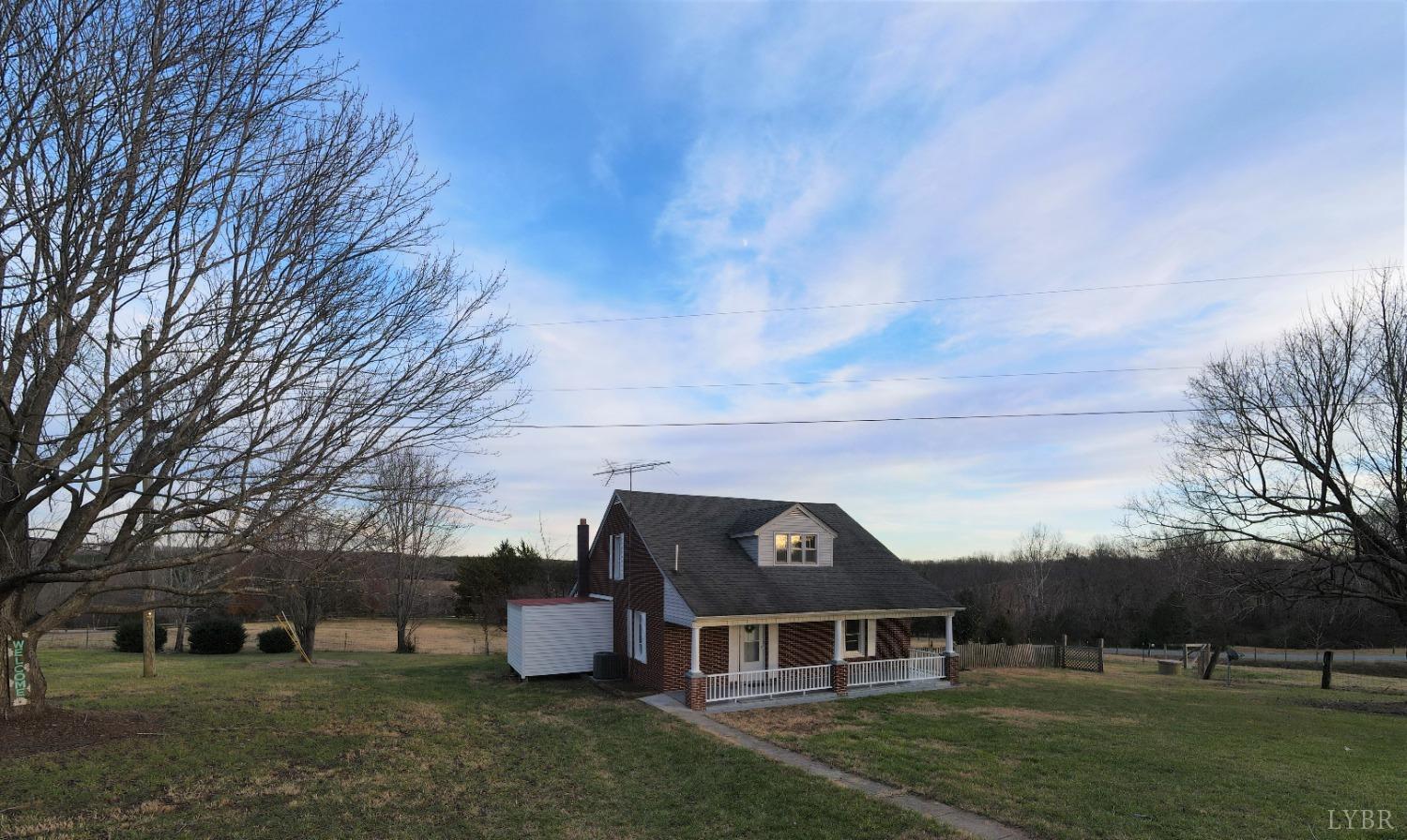 a aerial view of a house next to a yard