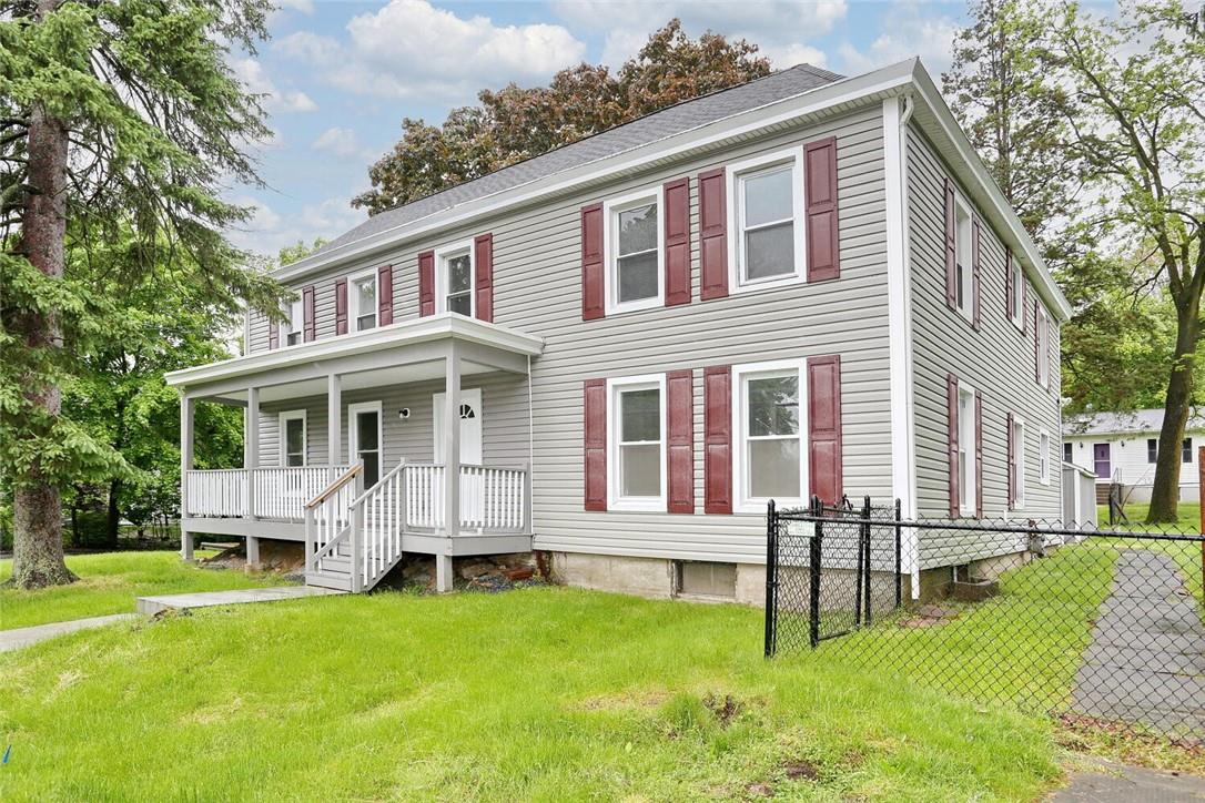 a front view of a house with a yard