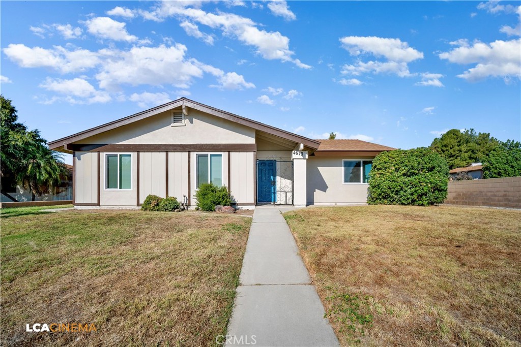 a front view of a house with yard