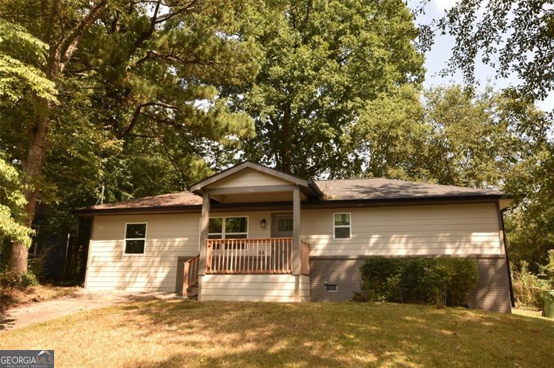 a front view of a house with yard