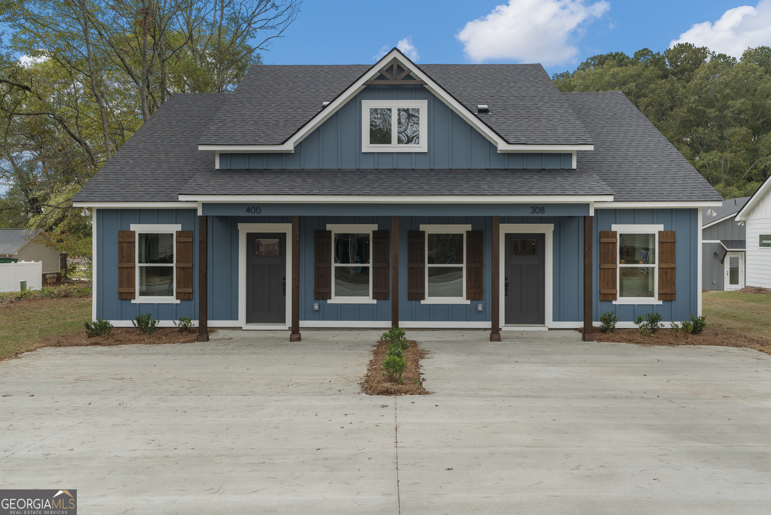 a house with trees in the background