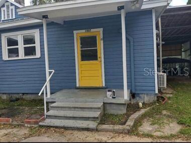 a front view of a house with stairs