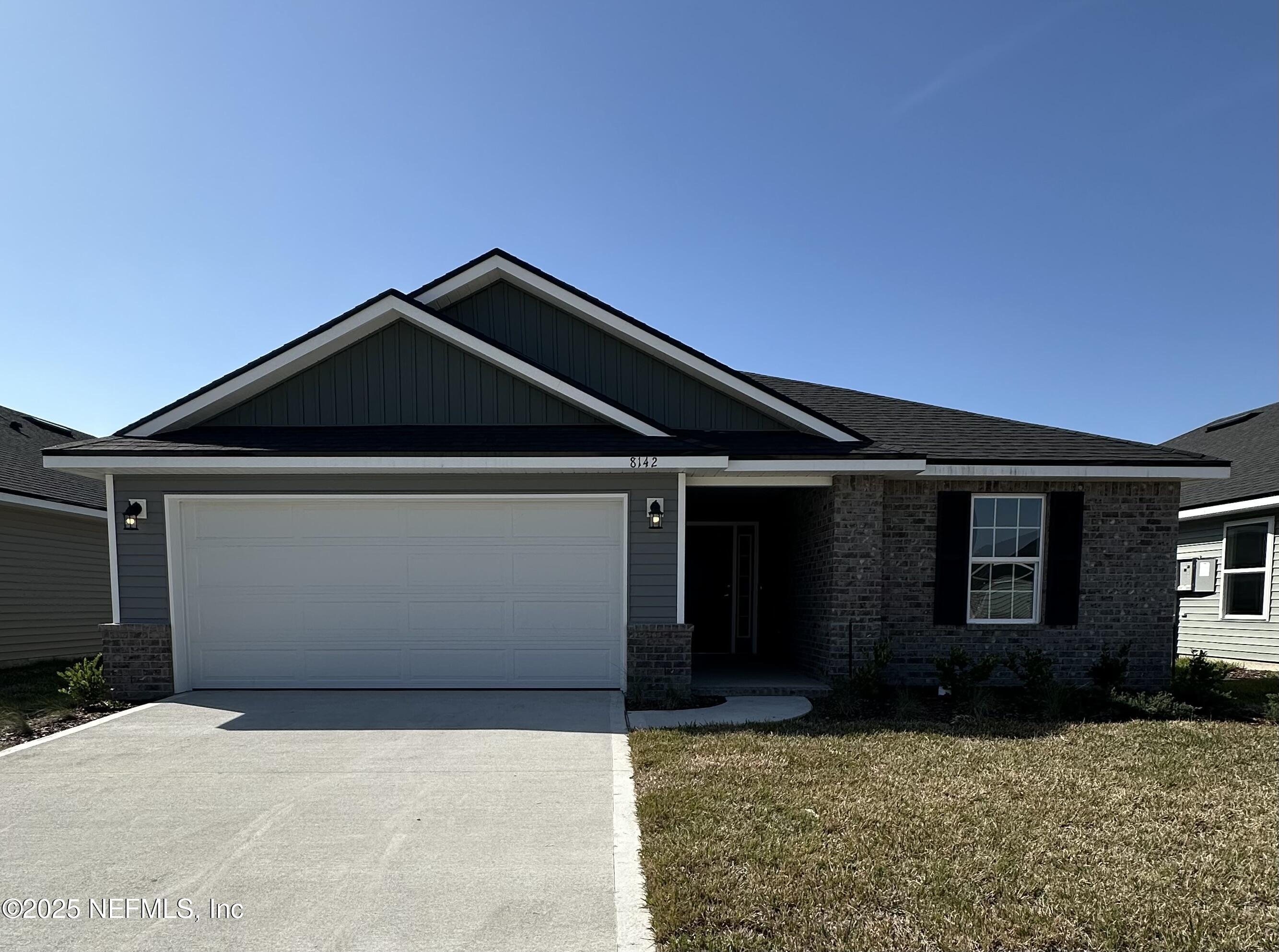 a front view of a house with yard