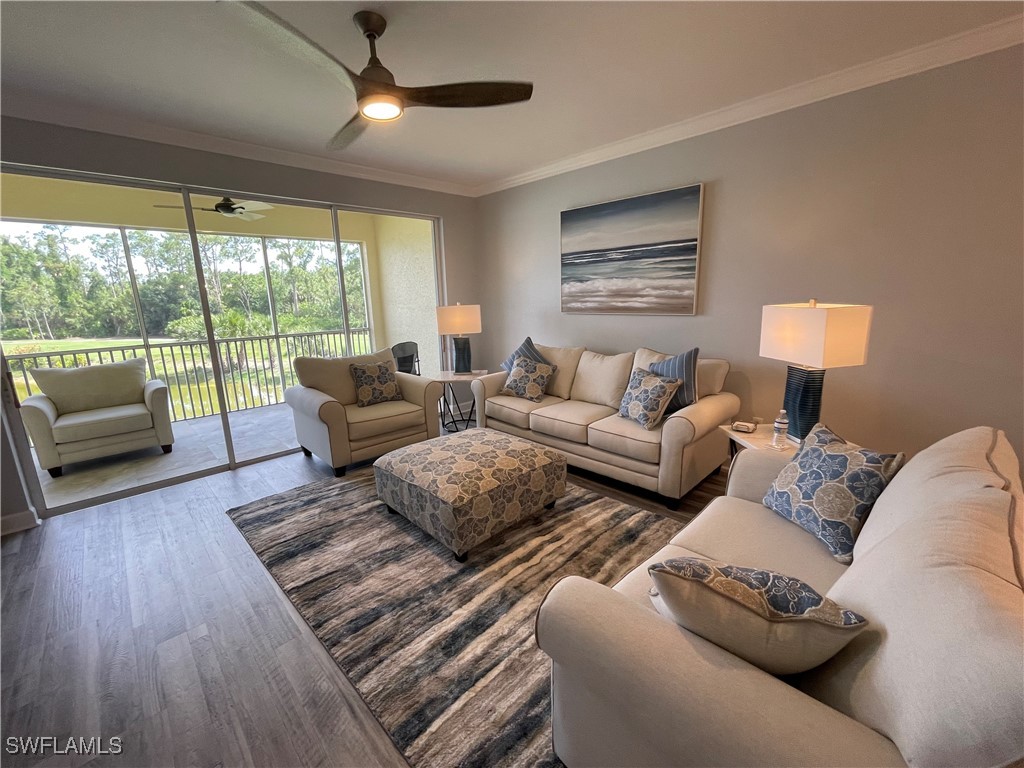 a living room with furniture and a lamp