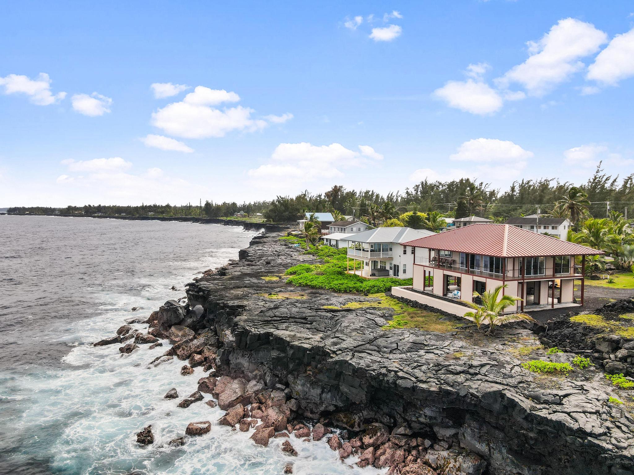 This stunning oceanfront home offers a rare opportunity to live amidst the serene beauty of Hawaii's coastline.