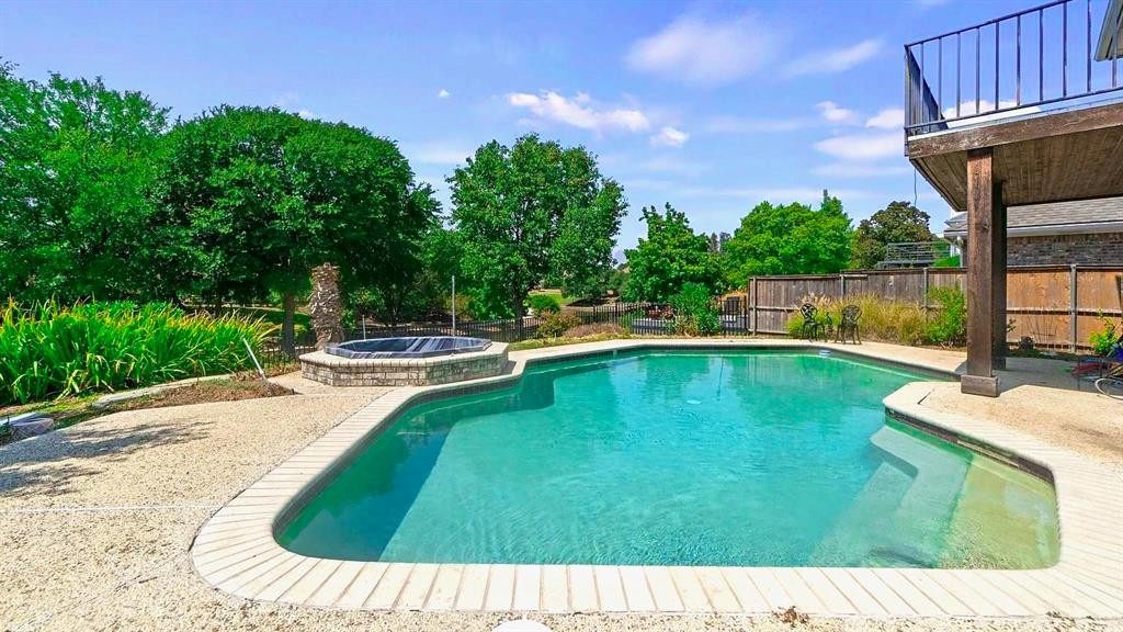 a view of a swimming pool with a patio