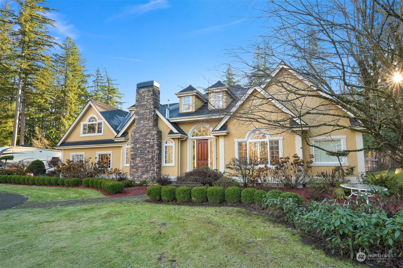 a front view of a house with garden