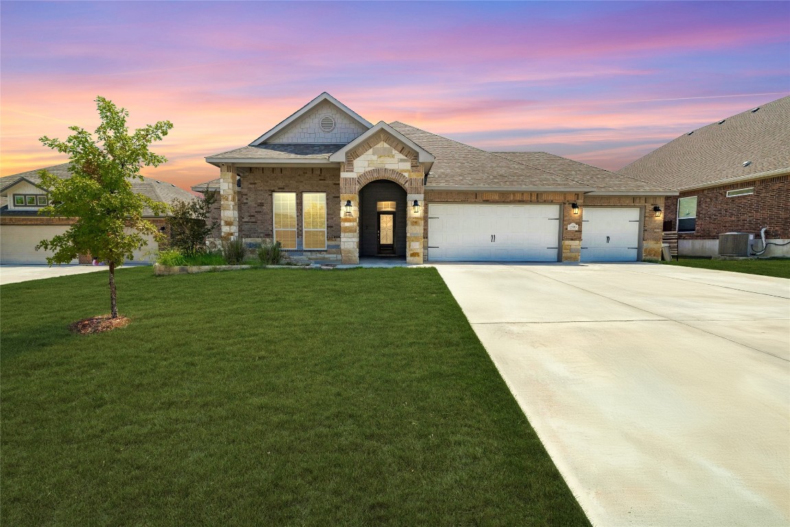 a front view of a house with a yard