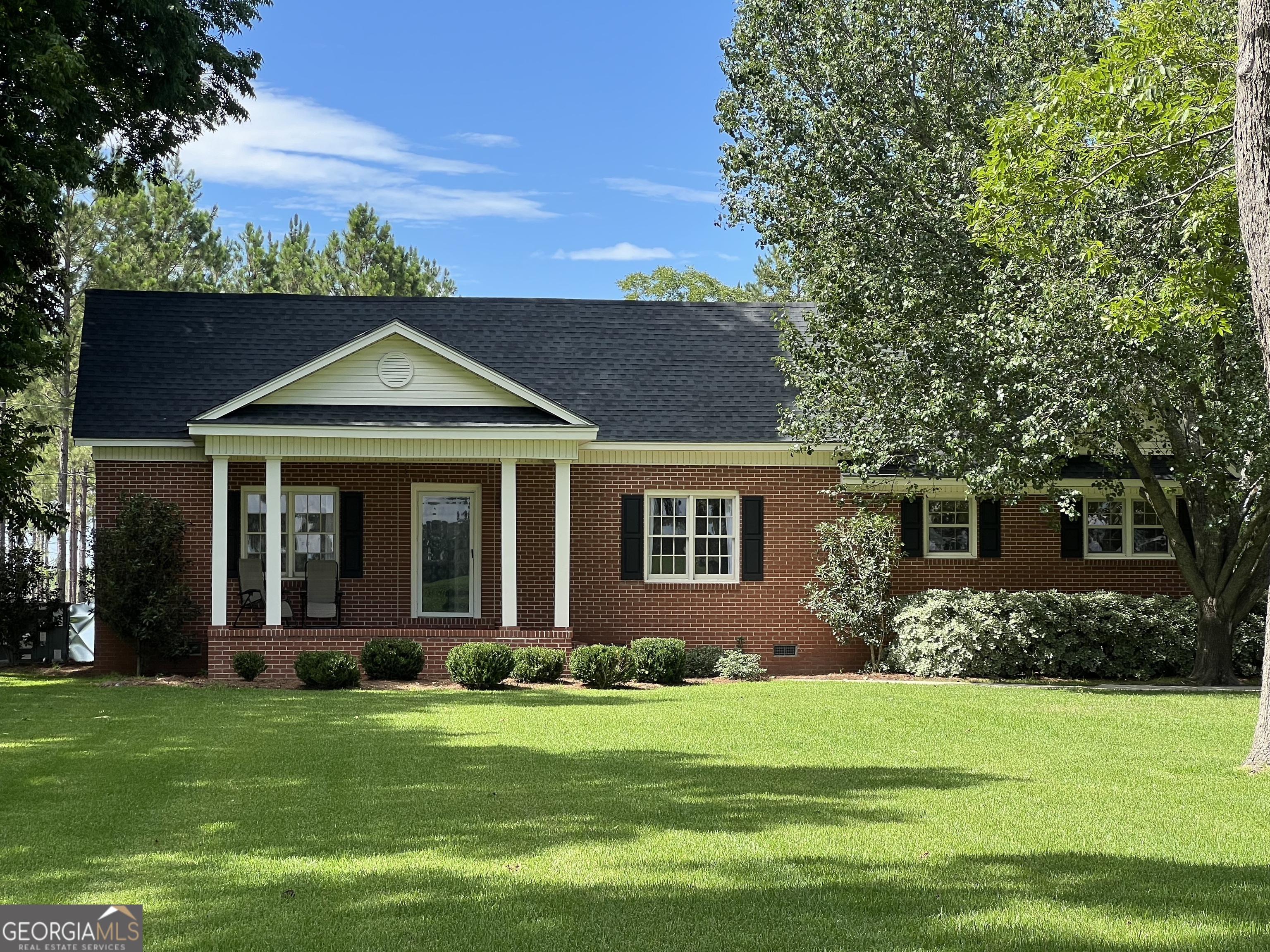 a front view of a house with a yard