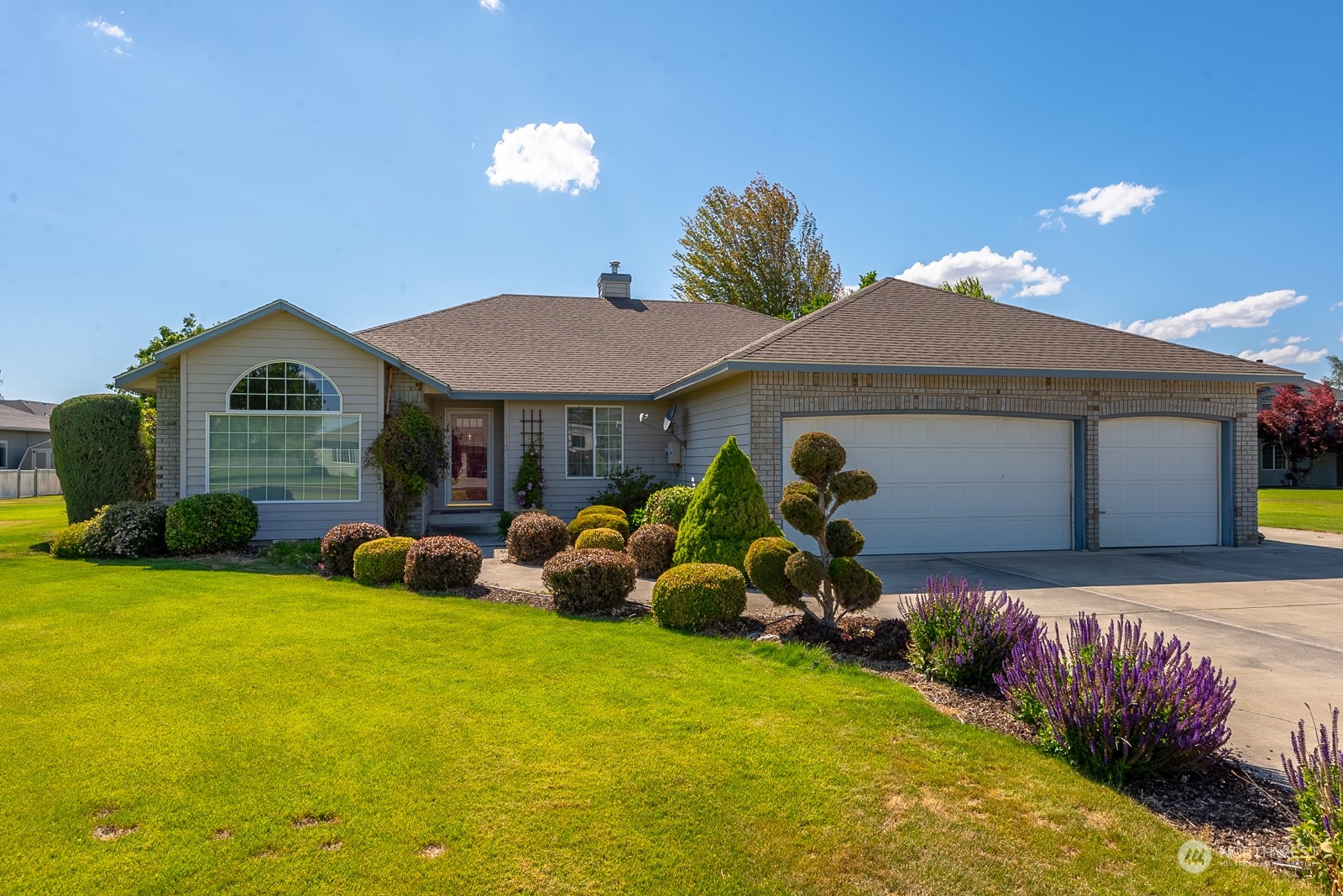 a front view of house with yard and seating area