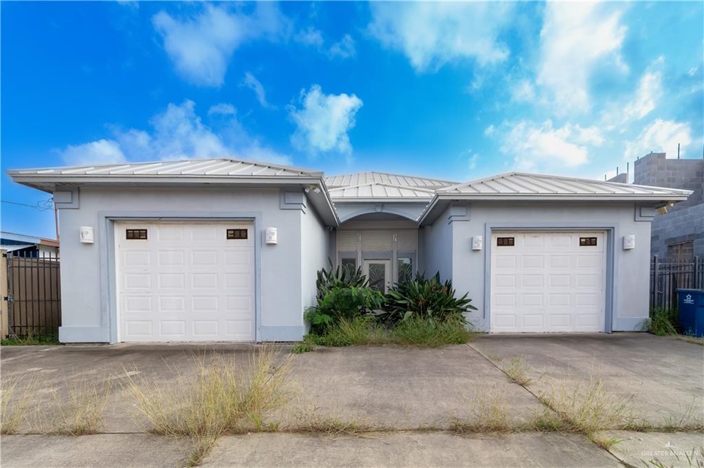 a view of a house with a garage