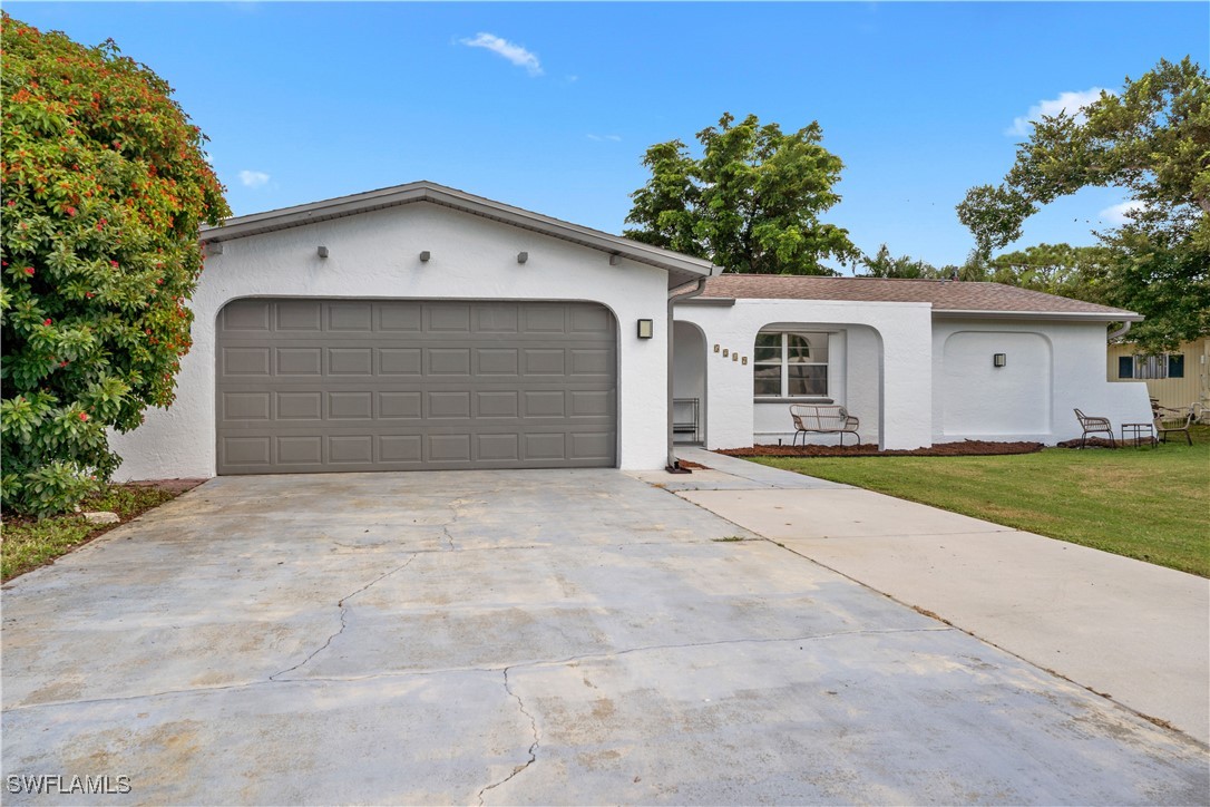 a front view of a house with a garage